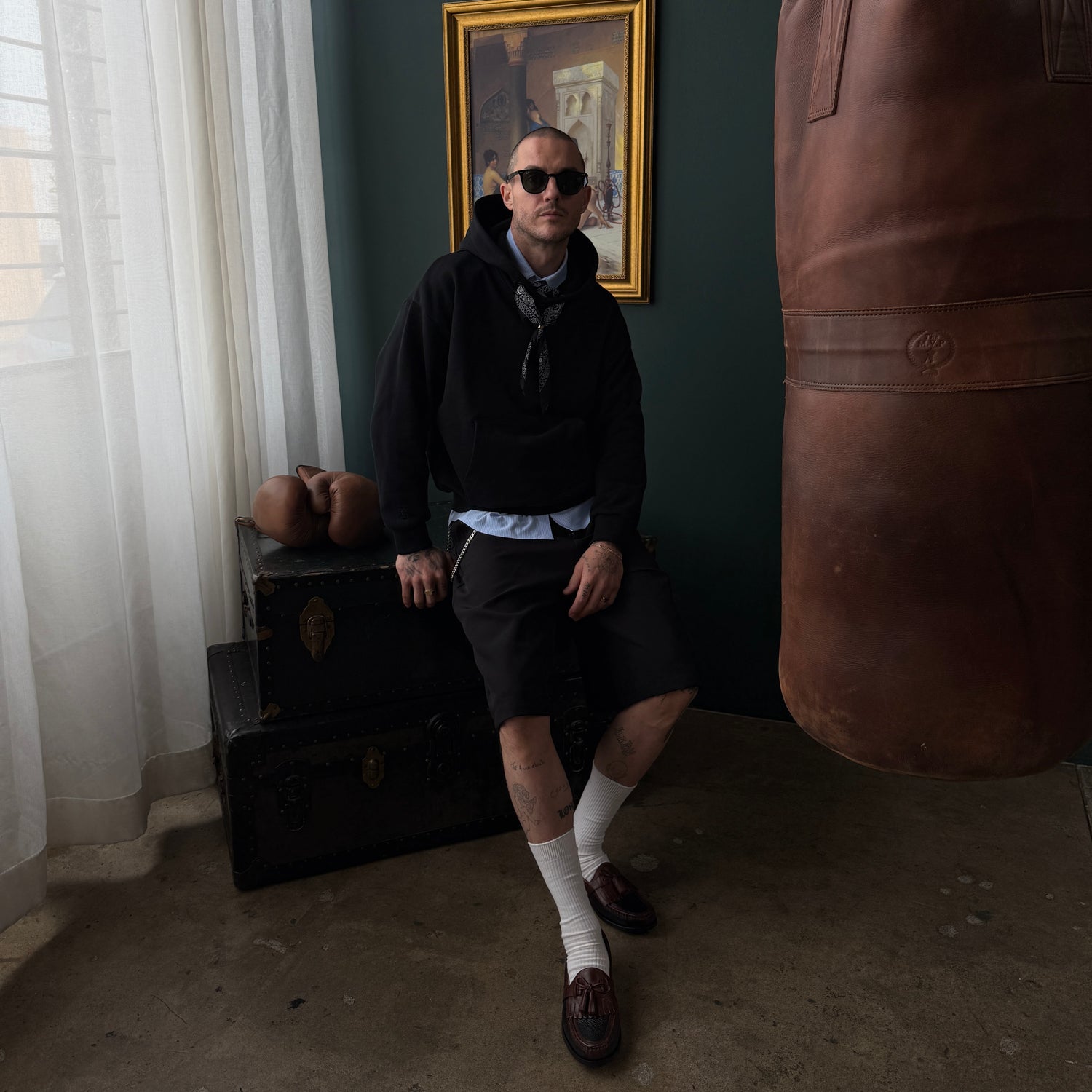 Noir Parisien Monceau Men's Black Hoodie Sweatshirt with Bandanoush and Ring by Belle Epoque Los Angeles, front view on model