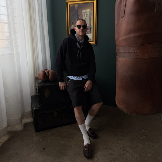 Noir Parisien Monceau Men's Black Hoodie Sweatshirt with Bandanoush and Ring by Belle Epoque Los Angeles, front view on model